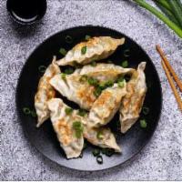 Fried Pork Dumplings 鍋貼 · 