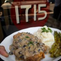 Oven Roasted Half Chicken · Mushroom sauce, grilled asparagus, and mashed potatoes 