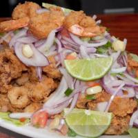 Jalea x 2 · Fish, shrimp, calamari, octopus and fried cassava with an onion and tomato topping. Serves 2.