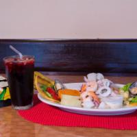 Ceviche Mixto · Fresh raw fish, calamari, shrimp and mussels marinated in citrus juices and spiced with chil...