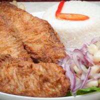 Pescado Frito · Fried tilapia fish with baked potato, yucas or french fries and rice. 
