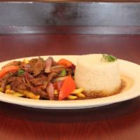 Lomo Saltado · Sauteed beef with tomatoes, onion, french fries and rice. 