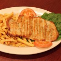 Pechuga a La Plancha · Juicy grilled chicken breast with french fries and salad. 