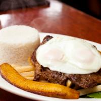 Bistec a Lo Pobre · Grilled steak served with fried eggs, french fries, plantains and rice. 