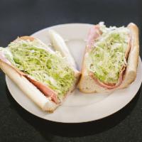 Italian Hoagie · Made with provolone cheese, lettuce, tomatoes and onions.