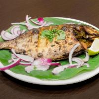 Tandoori Pomfret · Pomfret marinated in yogurt with Indian spices and cilantro and cooked in clay oven.