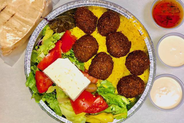 Falafel Platter  · Served with rice or French fries, greek salad, and pita bread. Tzatziki on the side. 