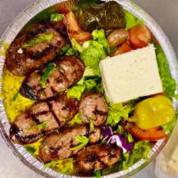Italian Sausage Platter  · Served with rice or French fries, greek salad, and pita bread. Tzatziki on the side. 