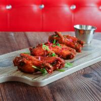 Buffalo Wings · Slightly spicy wings served with blue cheese.