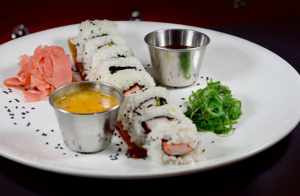 California Roll · Crab meat, avocado, cucumber topped with sesame seeds.