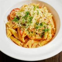 Penne Alla Vodka · Penna pasta in vodka sauce topped with your choice of meat.