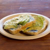 Avocado Toast · Avocado toast on grain bread with cream cheese and hemp seeds.