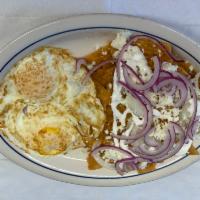 Chilaquiles  · Fried corn tortillas topped with your choice chicken or steak, covered in red or green sauce.