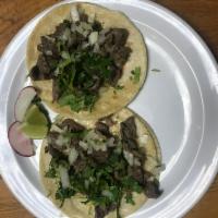 Bistec Taco · Steak. Served with onions, cilantro, onions, radish, limes and salsa on the side.