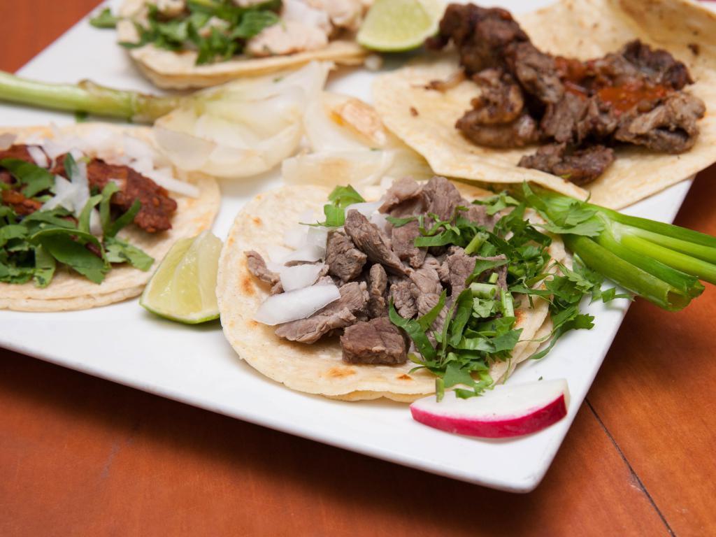 Lengua Taco · Beef tongue. Served with onions, cilantro, onions, radish, limes and salsa on the side.