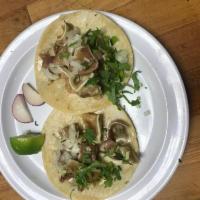 Oreja Taco · Pork ear. Served with onions, cilantro, onions, radish, limes and salsa on the side.