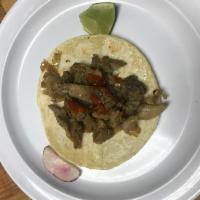 Oriental Taco · Spicy pork on corn tortilla. Served with onions, cilantro, onions, radish, limes and salsa o...
