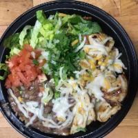 Burrito Bowl · Your choice of protein over rice, black or pinto beans, topped with lettuce, tomato, sour cr...