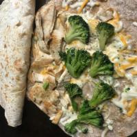 21. Broccoli and Chicken Quesadilla · Grilled chicken and broccoli with melted mozzarella and jack cheddar cheese on a choice of t...