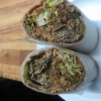 4. Steak Fajita Wrap · Grilled steak, grilled onions, peppers, tomatoes, chipotle sauce, rice, beans and lettuce.