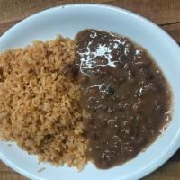 Arroz y Friloes · Mexican rice and pinto beans.