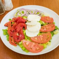 Angelo's Salad · Crispy romaine lettuce, tomatoes, red onions, fresh mozzarella and roasted peppers.