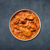 Chicken Tikka Masala · Fine pieces of boneless chicken with diced onions and peppers simmered in rich creamy tomato...