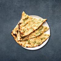 Garlic Naan · Fresh dough filled with garlic spread flat and baked in a indian clay oven.