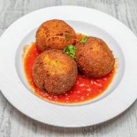 Rice Balls · Stuffed with meat, peas and fresh mozzarella.