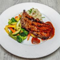 Rib Eye Steak · Baked to your liking with housemade sauce. Includes vegetables and  mashed potatoes.