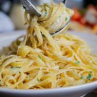Kid’s Fettuccine Alfredo · With grilled chicken. Gluten-friendly pasta available.