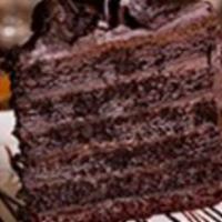 Truffle Chocolate Cake · Our colossal chocolate cake is crafted with layers of dark, moist chocolate and a silky truf...