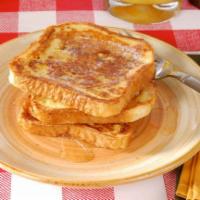 French Toast · Served with sausage or bacon or ham.