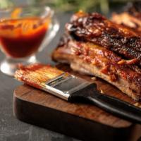 BBQ Pork Ribs · By pound. Chicharhones de cerodo costillas de cerdo a la BBQ.