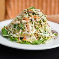 Chicken Chieu Salad · Thinly sliced cabbage, shredded chicken, red onion, carrot, peanuts, and aromatic herbs are ...