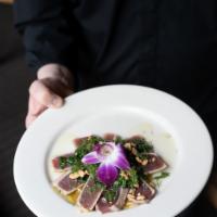 Hanoi Tuna · Fresh sashimi-grade ahi tuna marinated with shallot, garlic, and turmeric, seared rare, serv...