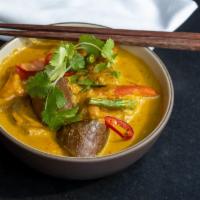 sayur lodeh · Javanese vegetarian curry with tofu puffs, chayote,
eggplant, peppers, green beans, cabbage ...