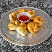 Garlic Knots  · 6 pieces. Rolled baked dough.