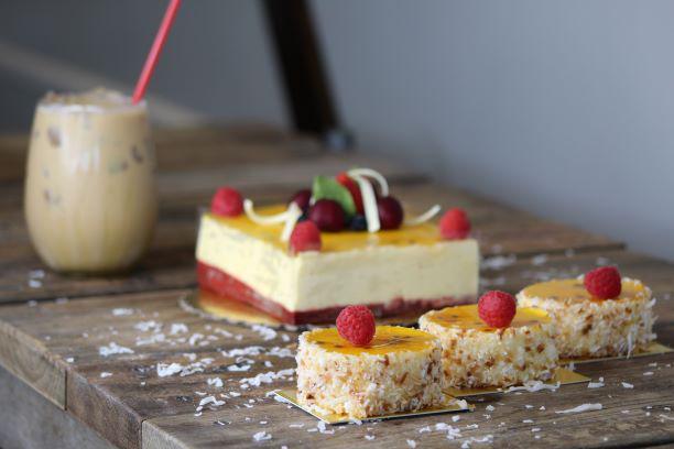 Passionata Mousse · Layers of cake and passion fruit mousse speckled with pineapple and passion fruit pulp