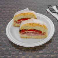 The Sicilian · Mortadella, provolone cheese, fried eggplant, roasted red peppers, balsamic dressing.
