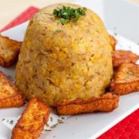 Dominican Mofongo with cheese  · Fried plantain and pork dish.