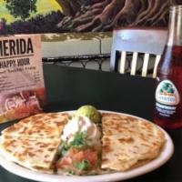 Quesadillas · Grilled flour tortillas filled with your choice of beef or chicken fajitas and cheese. Serve...
