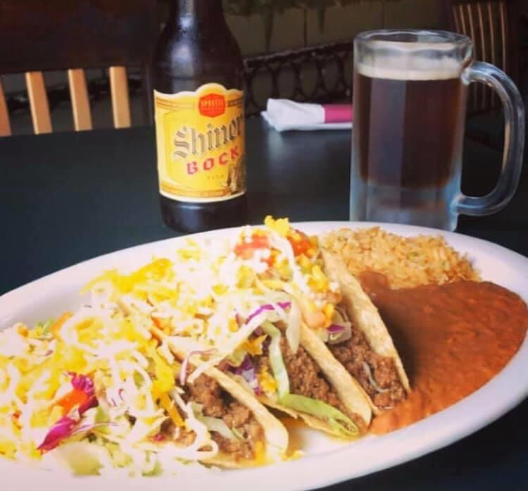 Tacos · Three tacos, soft or crispy, stuffed with beef or chicken and topped with lettuce, tomatoes and shredded cheese, served with rice and beans.
