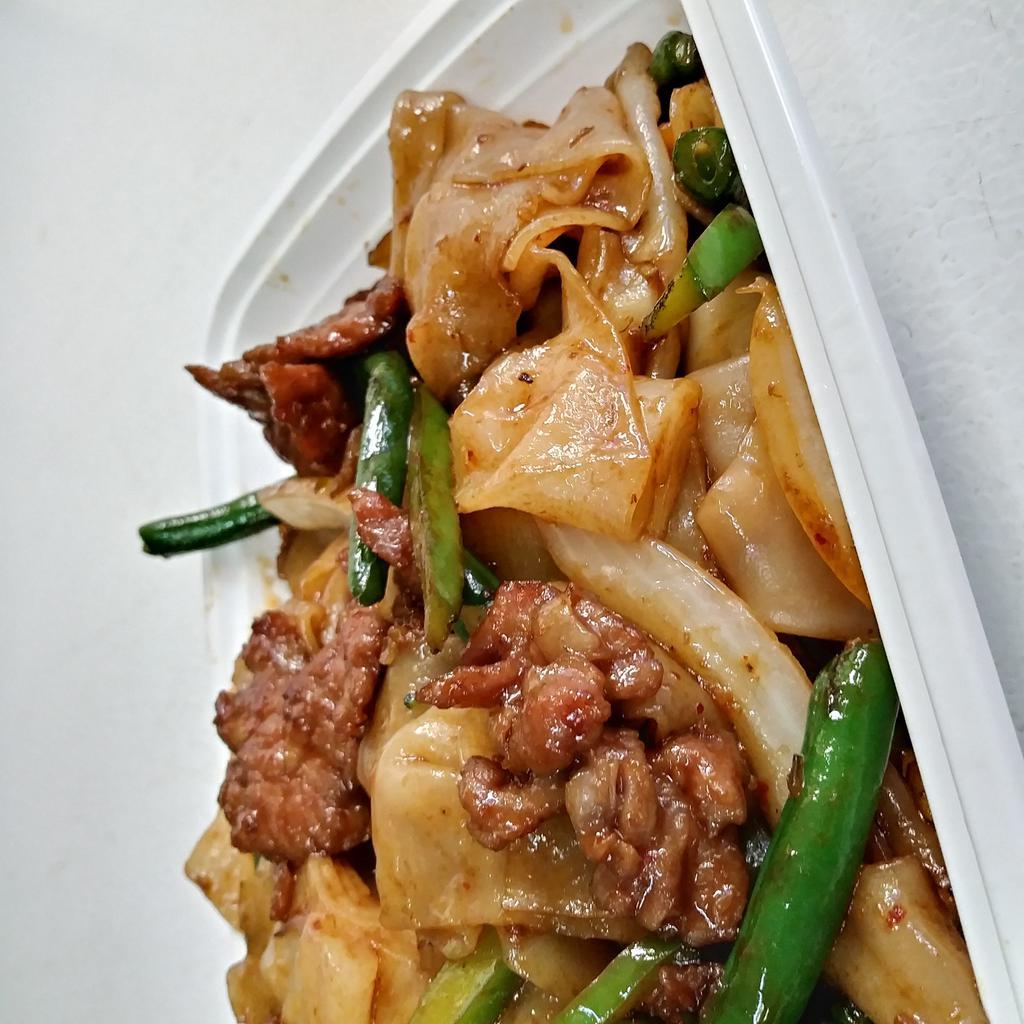 2. Drunken Noodles · This dish is made up of flat noodles sautéed with bell peppers, onions, string beans and Thai basil. Hot and spicy.