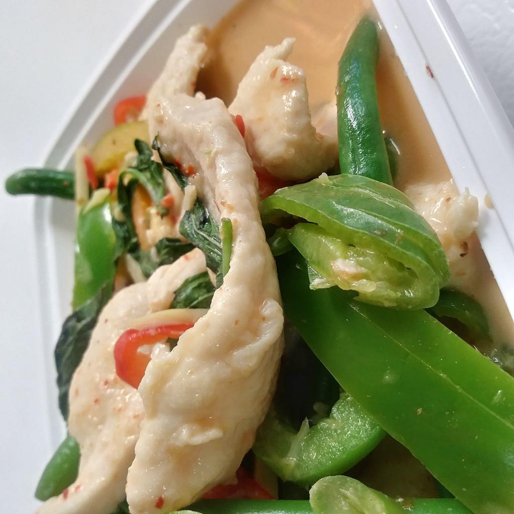 7. Red Curry · Red curry cooked with bamboo shoots, string beans, coconut milk, and Thai basil. Hot and spicy.