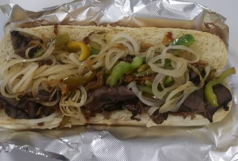 Hot Steak with Onion and Peppers Sub · Shaved beef with perfectly sauteed peppers and onions, and a drizzle of steak sauce to balance this feast! Your choice of cheese and additional toppings!