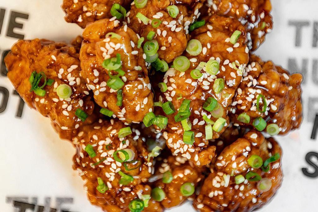 Tso Tswag · Our signature crispy chicken nuggets tossed in a General Tso-inspired Tswagoo sauce with sesame seeds