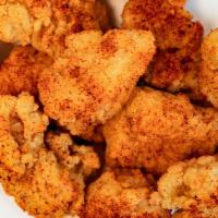 Sriracha Nuggets · Our signature crispy chicken nuggets tossed in a dry sriracha seasoning