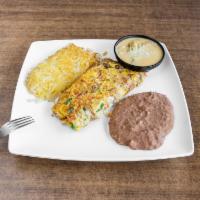 Huevos Rancheros Breakfast · 2 eggs over corn tortillas topped with chile con queso served with hash-browns and beans.