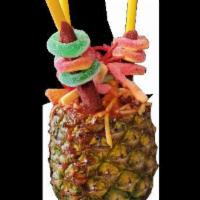 Piña Loca · All fresh fruit!! A whole Pineapple, Cucumber, shredded mango, chamoy, tamarind, tajin, lemo...
